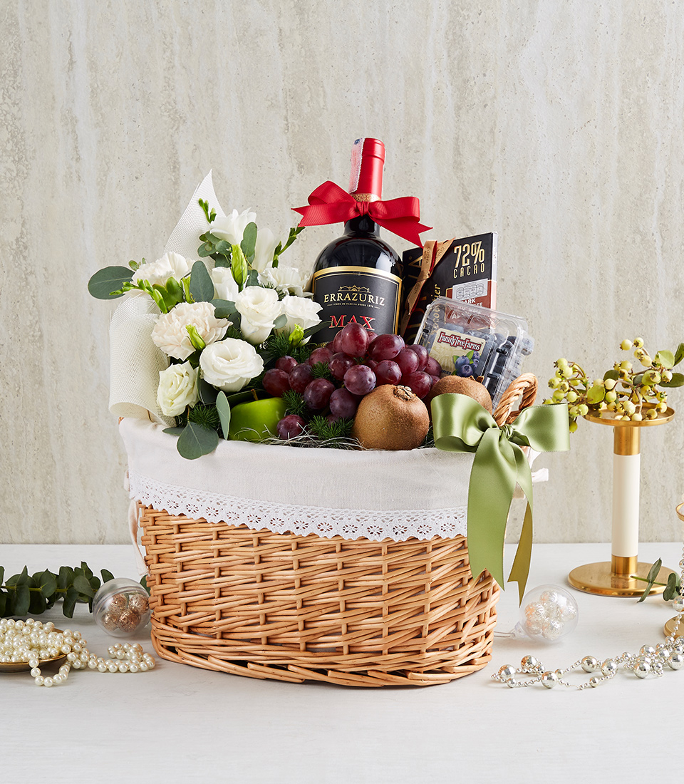 Gourmet Bliss: Red Wine, Chocolate, and a Medley of Fruits in a Basket