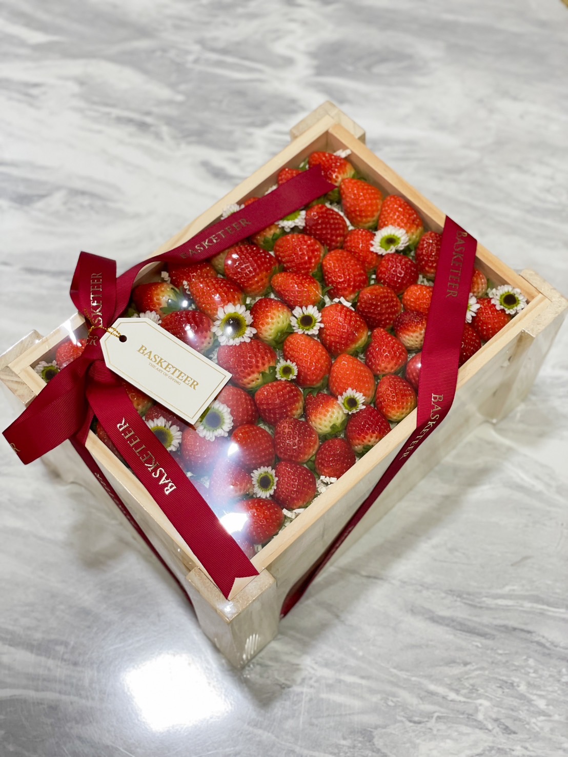 Luxurious spa gift basket with bath salts, scented candles, body lotions, and herbal teas by Basketeer.