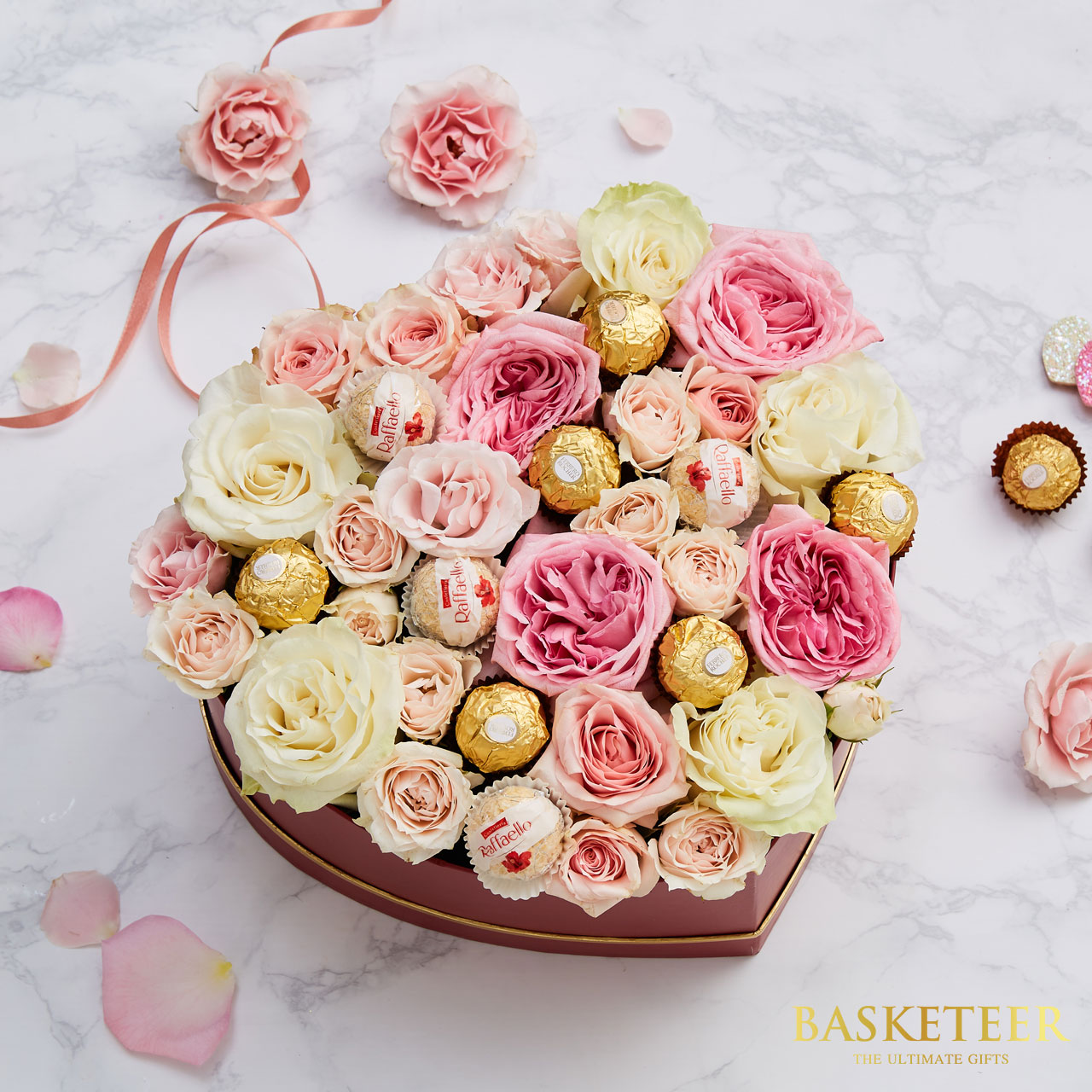Ferrero Rocher With Sweet Flowers in a heart-shaped gift box.