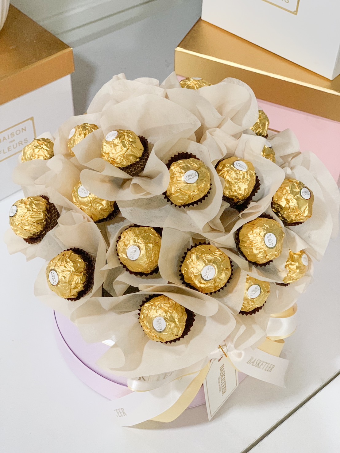 A stunning Ferrero Rocher chocolate bouquet, featuring gold-wrapped chocolates elegantly arranged in a floral-style bouquet. Perfect for celebrations, romantic surprises, and special occasions.