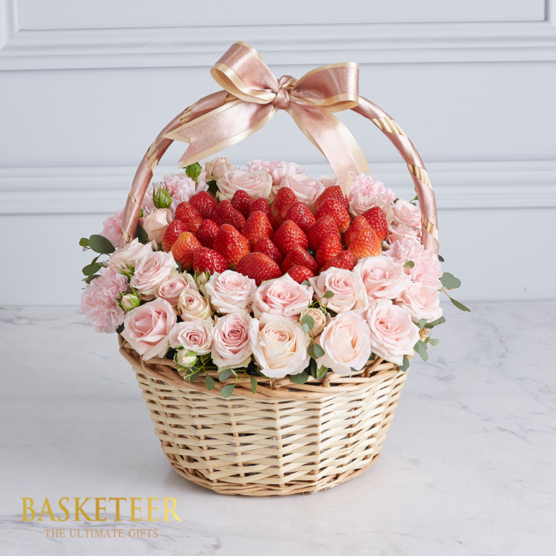 Fresh Strawberries With Pink Roses Surrounding Them In An Artisan Basket.