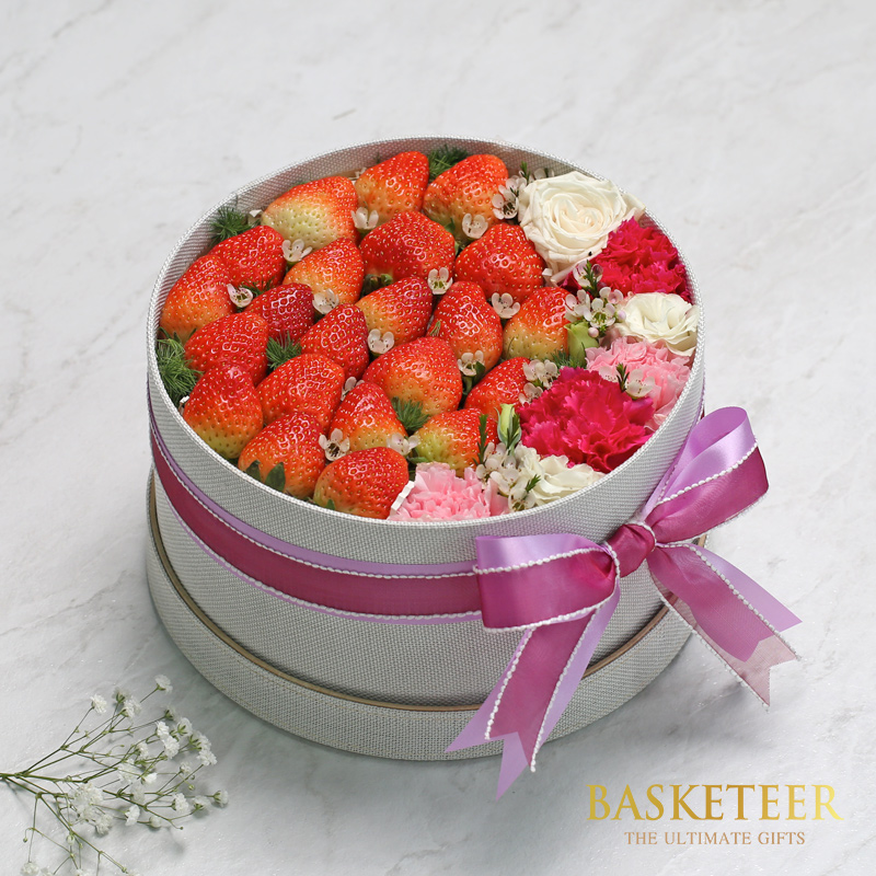 Fresh Strawberries With Flowers In The Gray Box