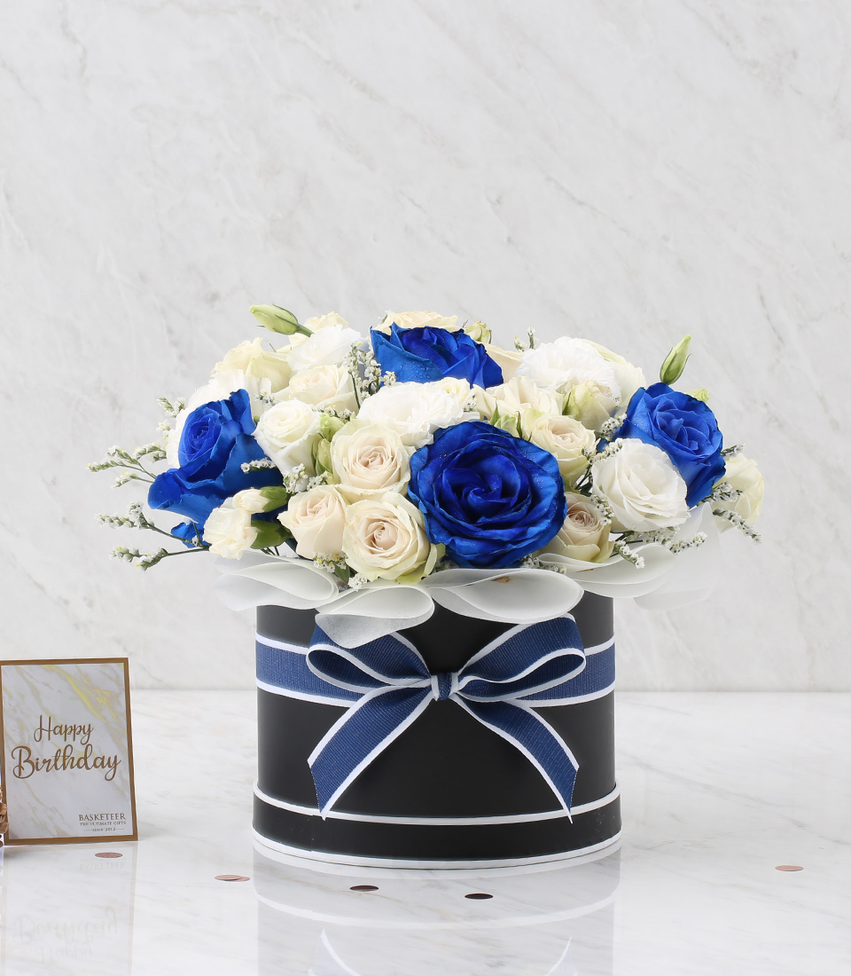 Blue And White Roses In The Black Box With a Blue Bow