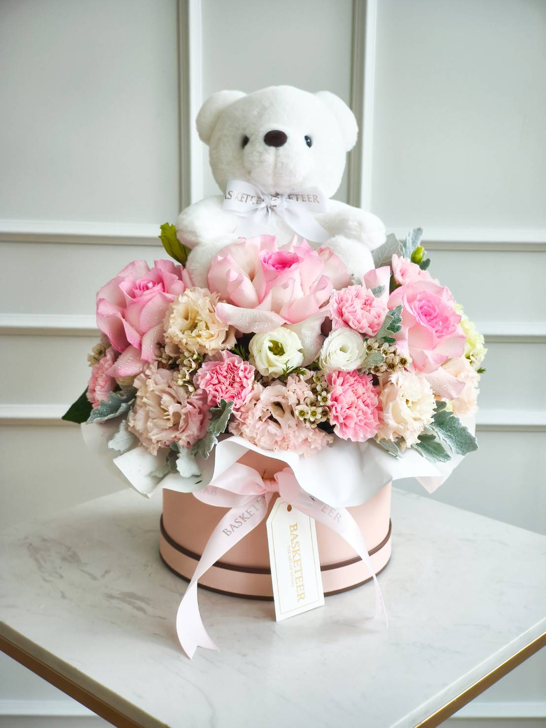 Pastel pink flower box arrangement with roses, carnations, and a white teddy bear – luxury gift for birthdays and celebrations