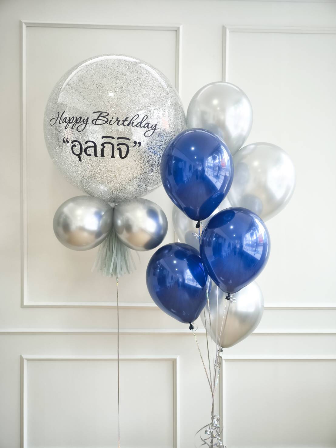 Silver and blue birthday balloon bouquet with large glitter balloon and personalised message
