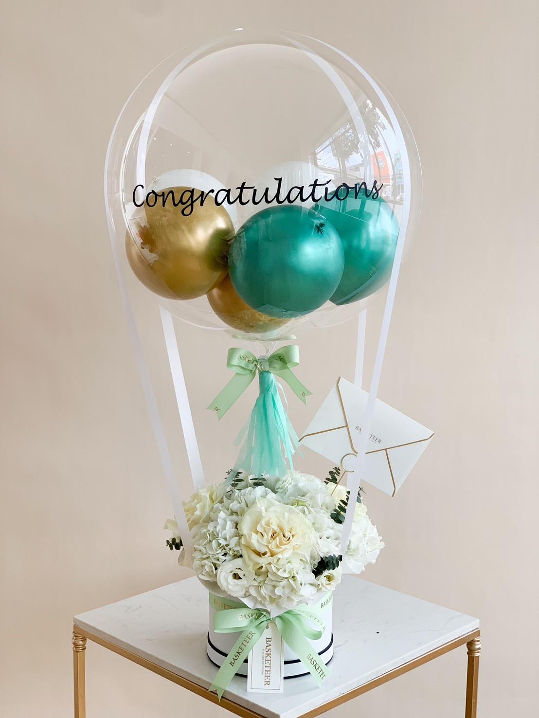 A decorative arrangement features a clear 