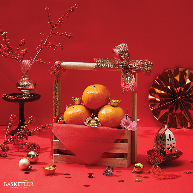 Mandarin Orange Chinese New Year Gift In The Wooden Basket With a Bow