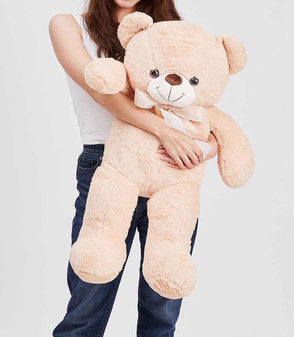 Discover the charm of our light brown teddy bear gift! Whether it's for her or any special occasion, this adorable teddy will bring joy and warmth.