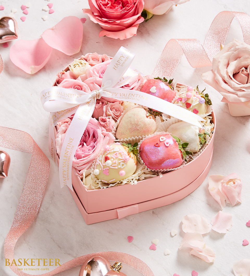 Indulge in our Sweet Pink-white Covered Strawberries Gift with Pink Roses Heart Box! Each luscious strawberry is dipped in a delicate pink-white chocolate coating, beautifully presented alongside a stunning arrangement of pink roses in a heart-shaped box. Perfect for expressing affection, celebration, or gratitude, this gift ensemble is sure to delight your loved ones. Order now for a sweet and memorable surprise!