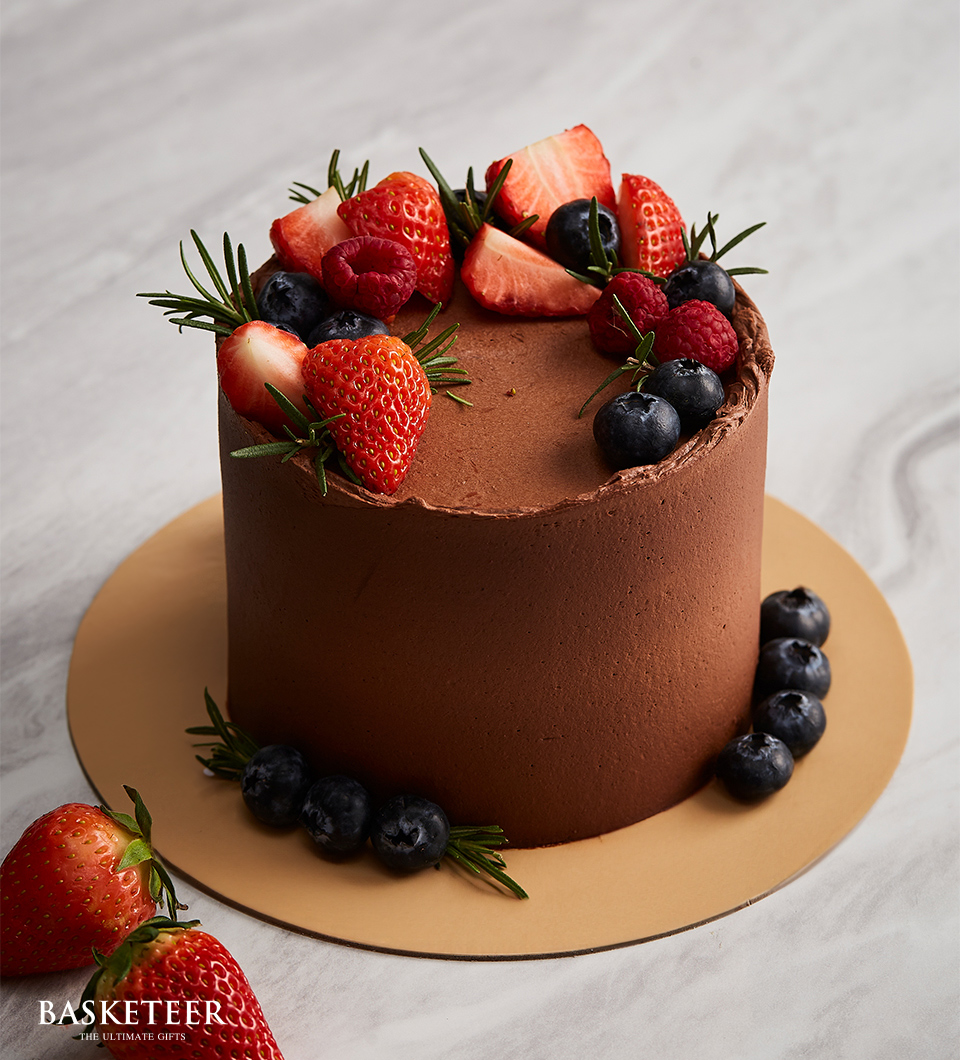 Mini cake premium dark chocolate frosting seasonal fruits