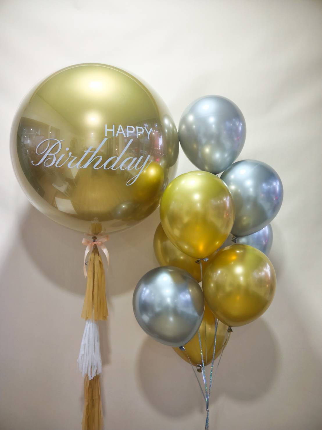 Luxury gold and silver birthday balloon set with a giant personalized balloon and metallic balloons for elegant celebrations.