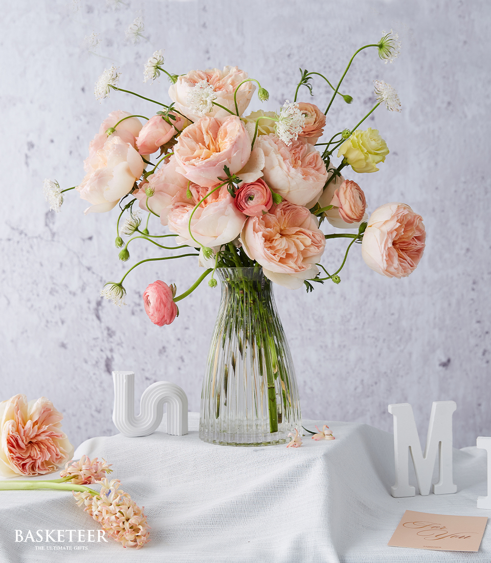 Flowers in a vase import roses