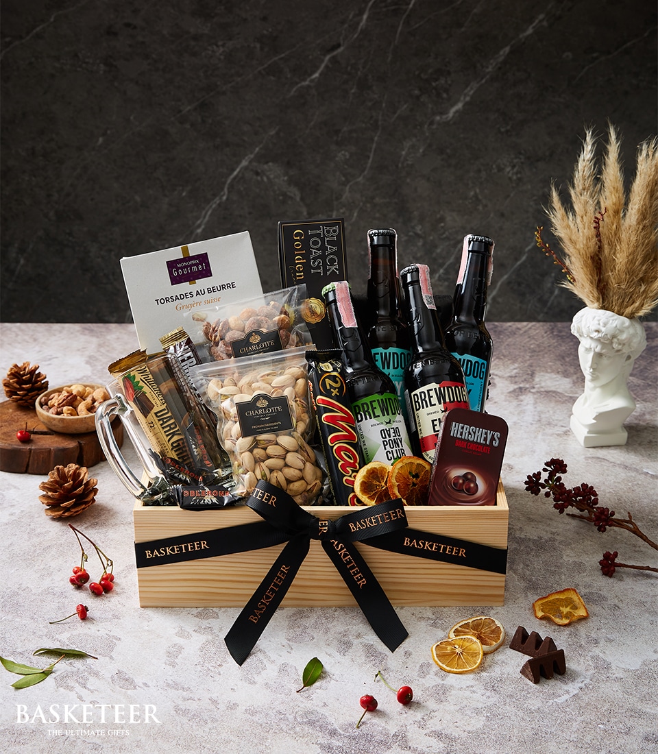 A beautifully crafted wooden gift basket, adorned with elegant black ribbons bearing the 
