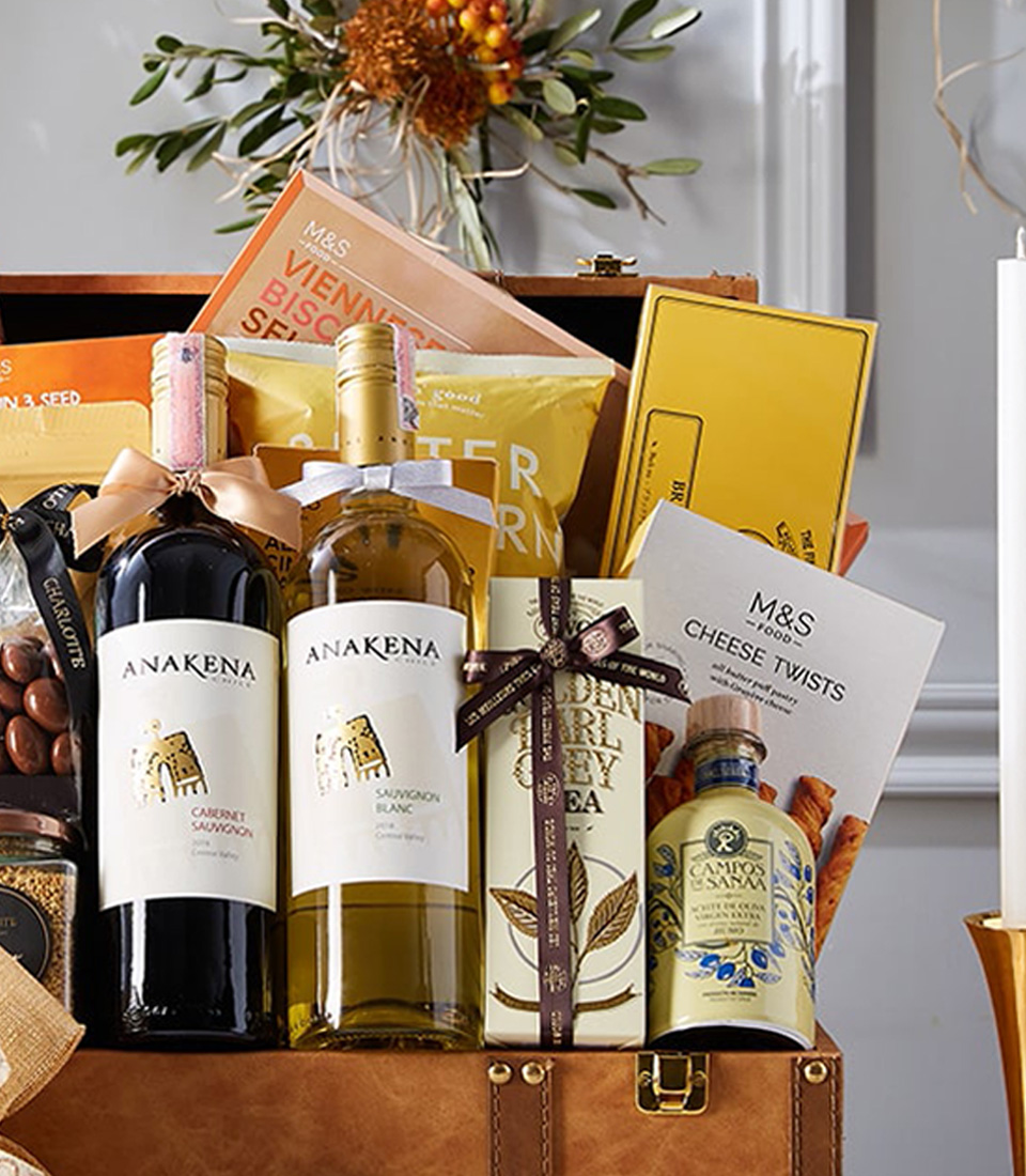 Indulge in luxury with our Deluxe Wine Duo in Leather Hamper with Gourmet Gift. This exquisite set features two bottles of premium wine nestled in a sophisticated leather hamper, accompanied by a selection of gourmet treats. Perfect for special occasions or treating someone special. Order now and elevate your gifting experience!