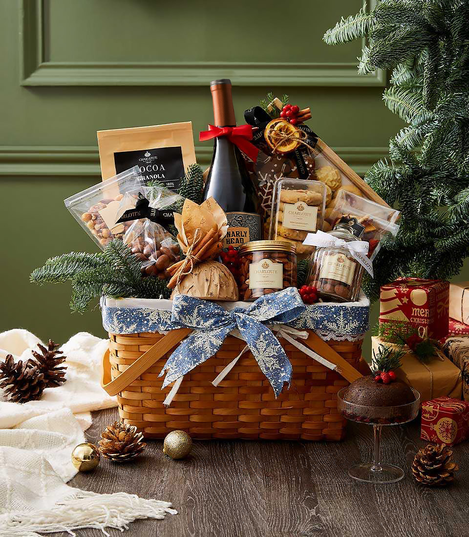 Woven basket with Gnarly Head red wine, cookies, nuts, chocolates, jam, and blue snowflake Christmas bow
