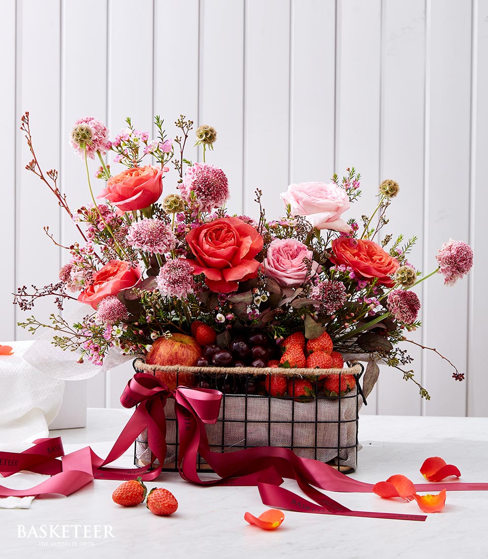Pink O' Hara Roses With Fresh Fruits In The Black Steel Frame Basket