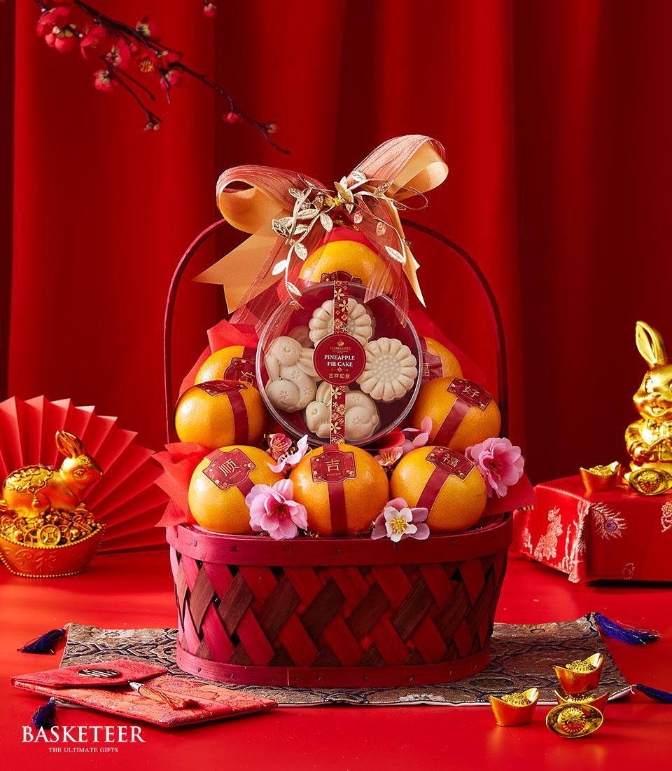 Mandarin Orange With Pineapple Cake In The Red Basket With a Bow, Chinese New Year Gift