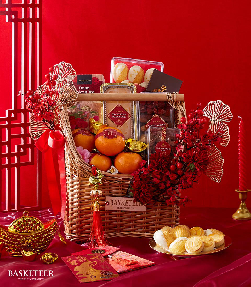 Mandarin Orange, Chocolate, Dried Mixed Fruits And Orange Zest Pound Cake With Flowers Decoration In The Basket, Chinese New Year