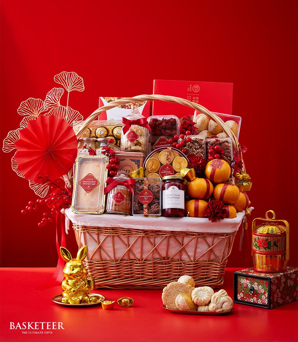 Chinese New Year Gift In Mandarin Orange, Cookies, Orange Zest Pound Cake, Bird's Nest and many In The Basket With Decoration.