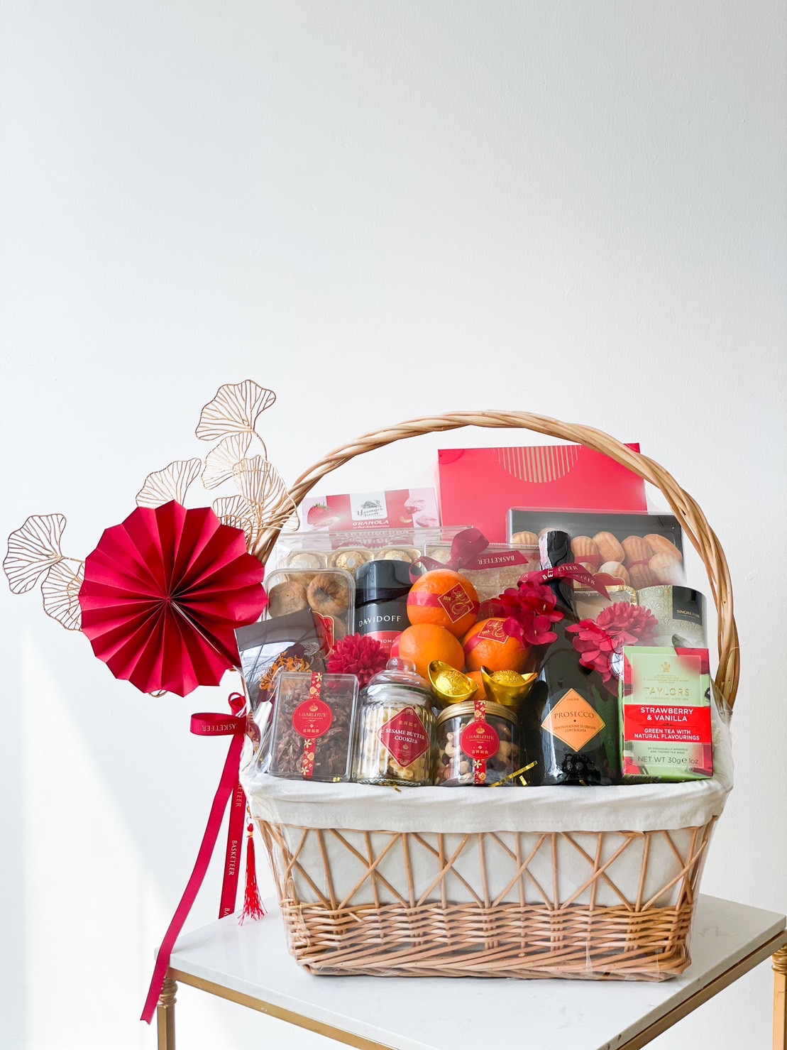 Wine, Mandarin Orange, Cookies, Tea and Many Treats Delicious Chinese New Year In The Basket