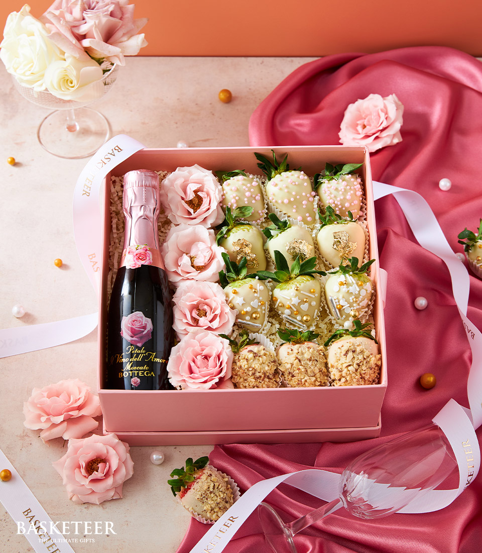 Valentine's Day Gift In Wine With Chocolate Covered Strawberry and Fresh Flower In The Heart Pink Box.