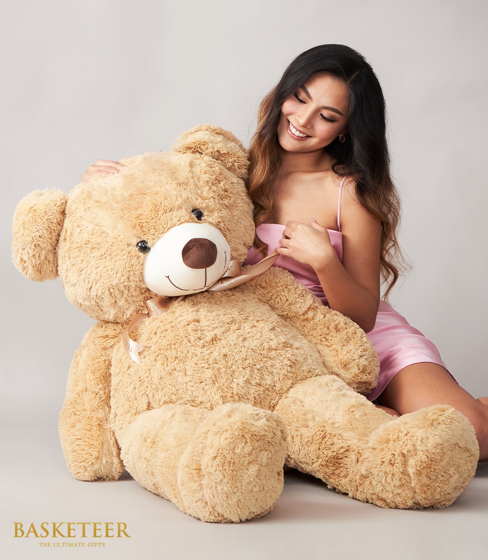Surprise her with our adorable Big Brown Teddy Gift! Perfect for any occasion, this cuddly teddy bear is sure to bring joy and warmth to her heart.