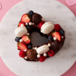 Valentine's Day Chocolate Heart Cake with Macarons and Mixed Berry Topping.