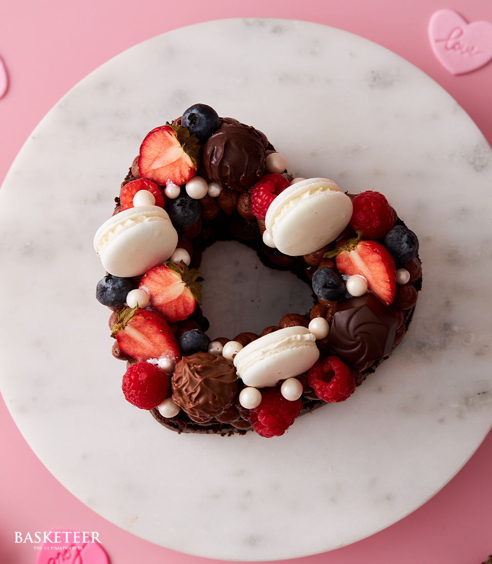 Valentine’s Day Chocolate Heart Cake with Macarons and Mixed Berry Topping.