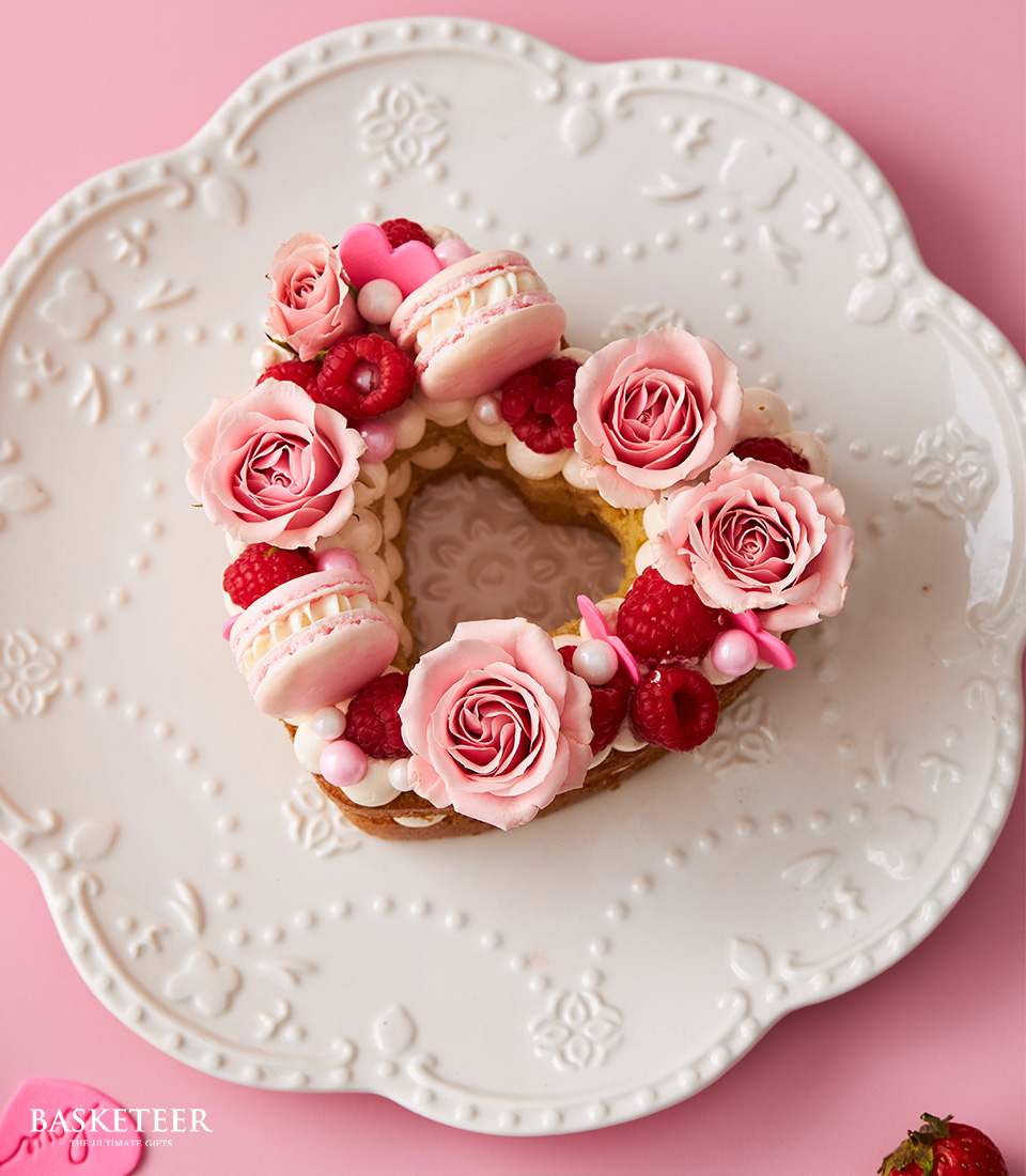 Valentine's Day Butter Cream Heart Cake with Macarons, Raspberries and Fresh Pink Roses Topping.