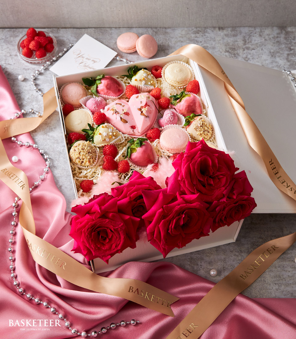 Treat your loved one to our Sweet Love Roses Box Set, complete with chocolate-covered strawberries, heart-shaped pink chocolates, fresh raspberries, and delicate macarons. Perfect for celebrating love and special occasions. Order now and spread sweetness!