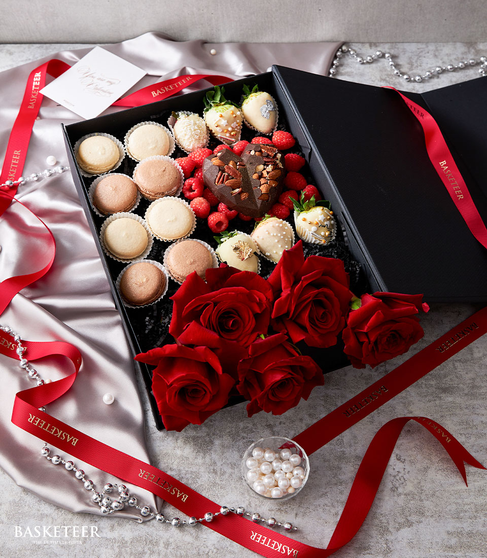 Valentine's day Red Explorer Roses, Unbreakable Heart Chocolate, Macarons and Chocolate Covered Strawberries In The Black Box.