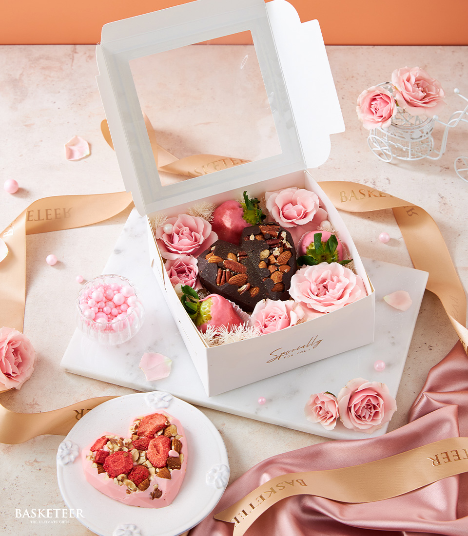 Indulge in our Heart Chocolate & Pink Strawberries with Pink Roses Gift Box, featuring delicious chocolates, fresh strawberries, and beautiful pink roses, perfect for special occasions and celebrations.