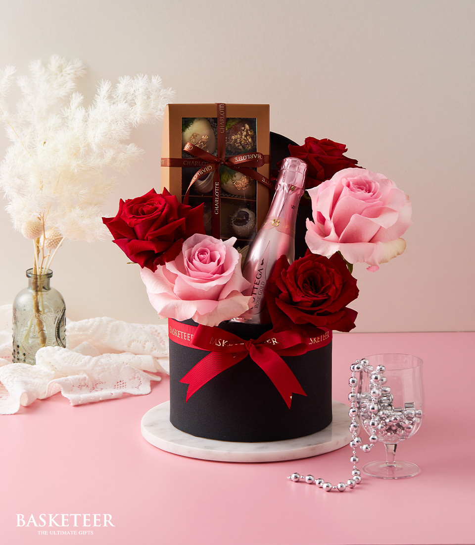 Indulge in our delightful Pink Wine & Rose Gift Box, paired perfectly with sumptuous chocolates.