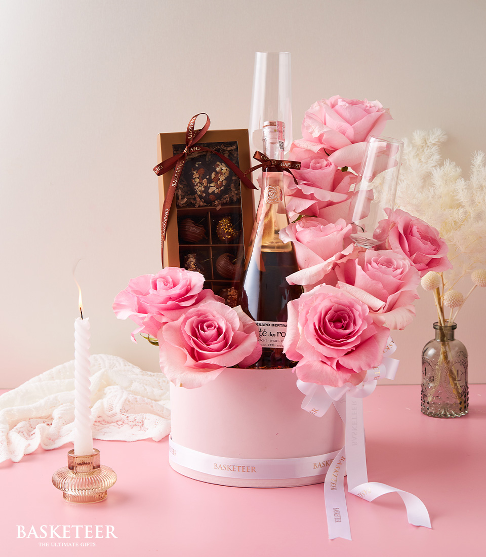 Valentine's day In Wine With Chocolate-Covered Cherries and Sweet Pink Roses In The Soft Pink Box with a White Bow.