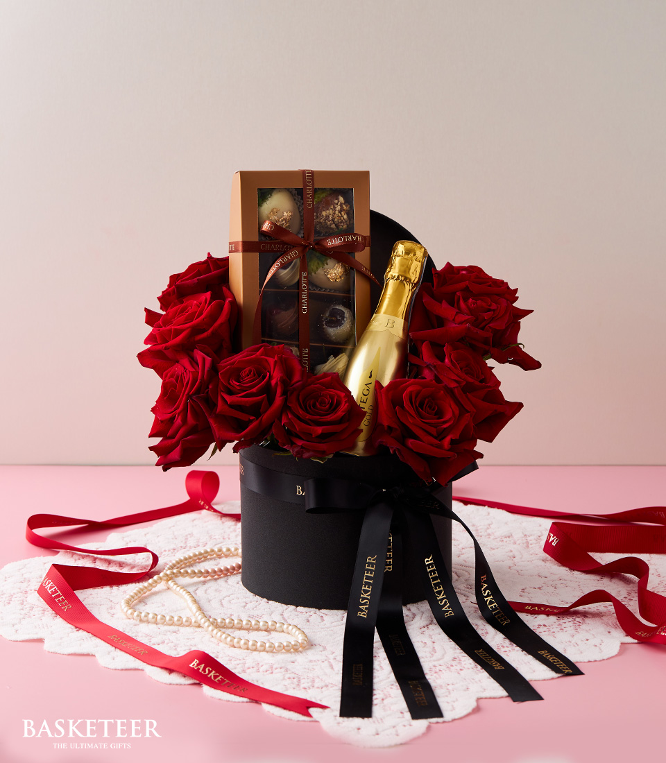 Indulge in the ultimate expression of love with our Love Elegance Wine Roses Gift Set. Featuring exquisite roses, a bottle of fine wine, decadent chocolates, all presented in a sleek black box.