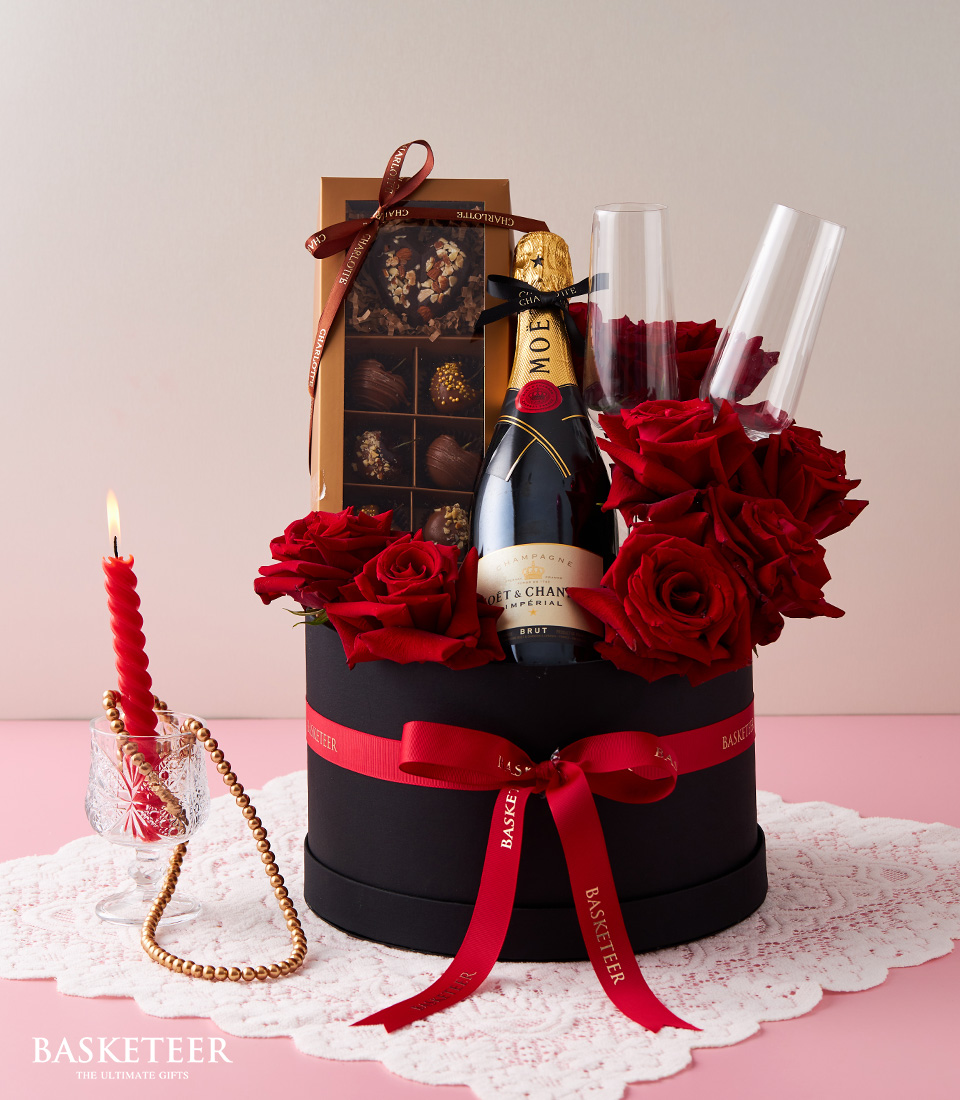 Valentine's day Moet & Chandon Imperial Brut Wine, Red Explorer Roses, Chocolate-Covered Cherries and Flute Champagne Glasses In The Black Box With a Red Bow.