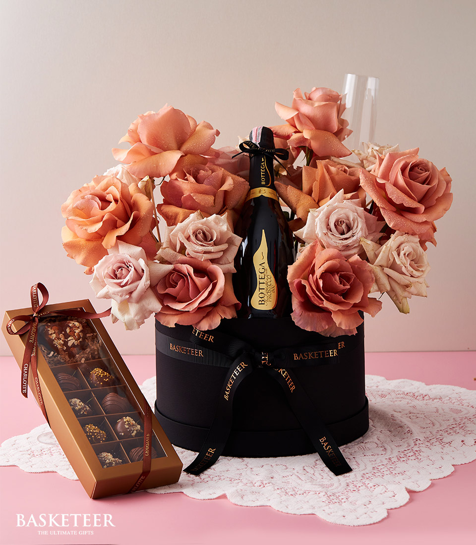 Explore our luxurious Floral Champagne Chocolate-Covered Gift Box, a delightful combination of champagne, chocolates, and beautiful blooms