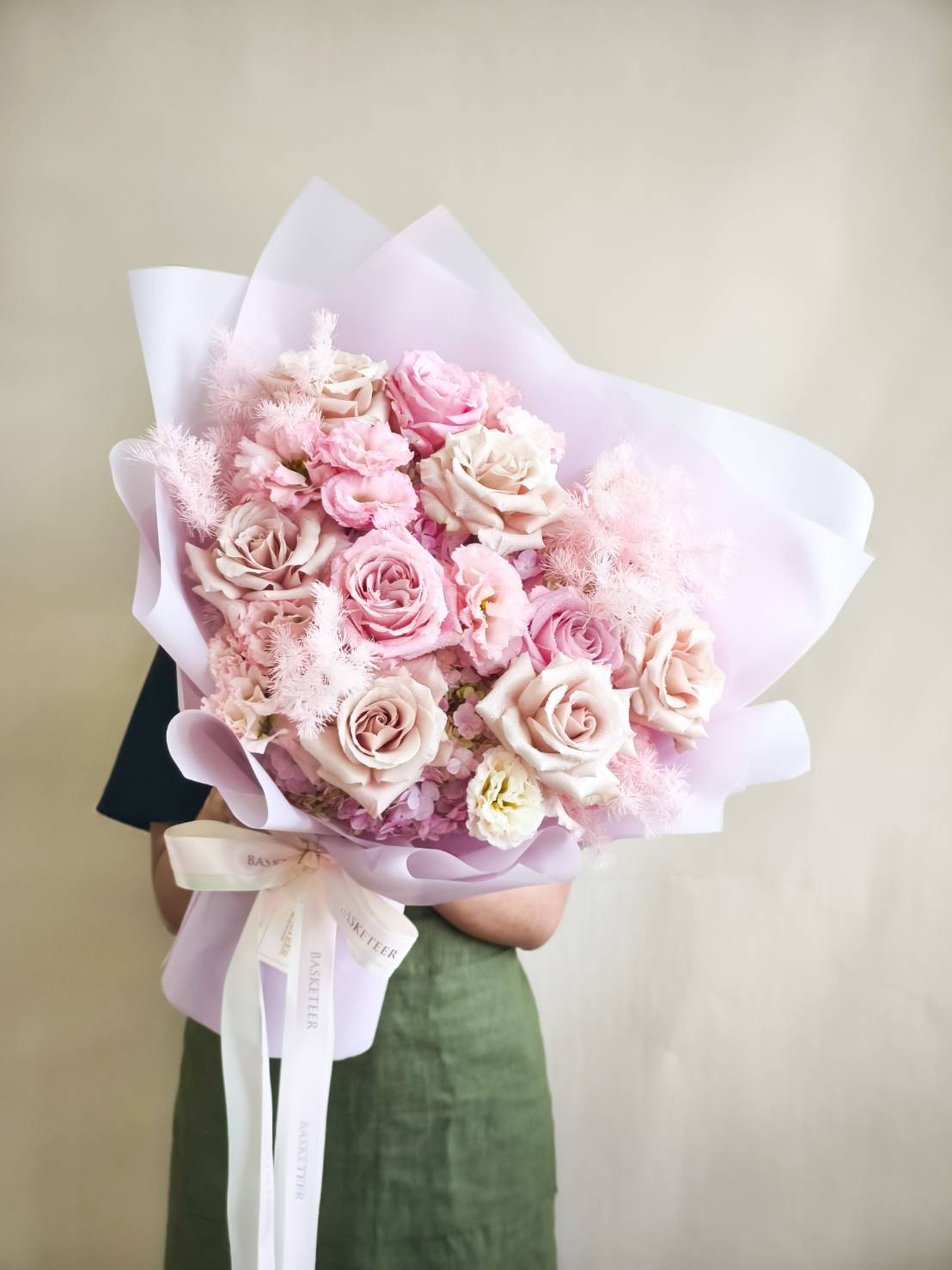 Elegant bouquet with pastel pink roses, lisianthus, hydrangeas, and soft astilbe accents.