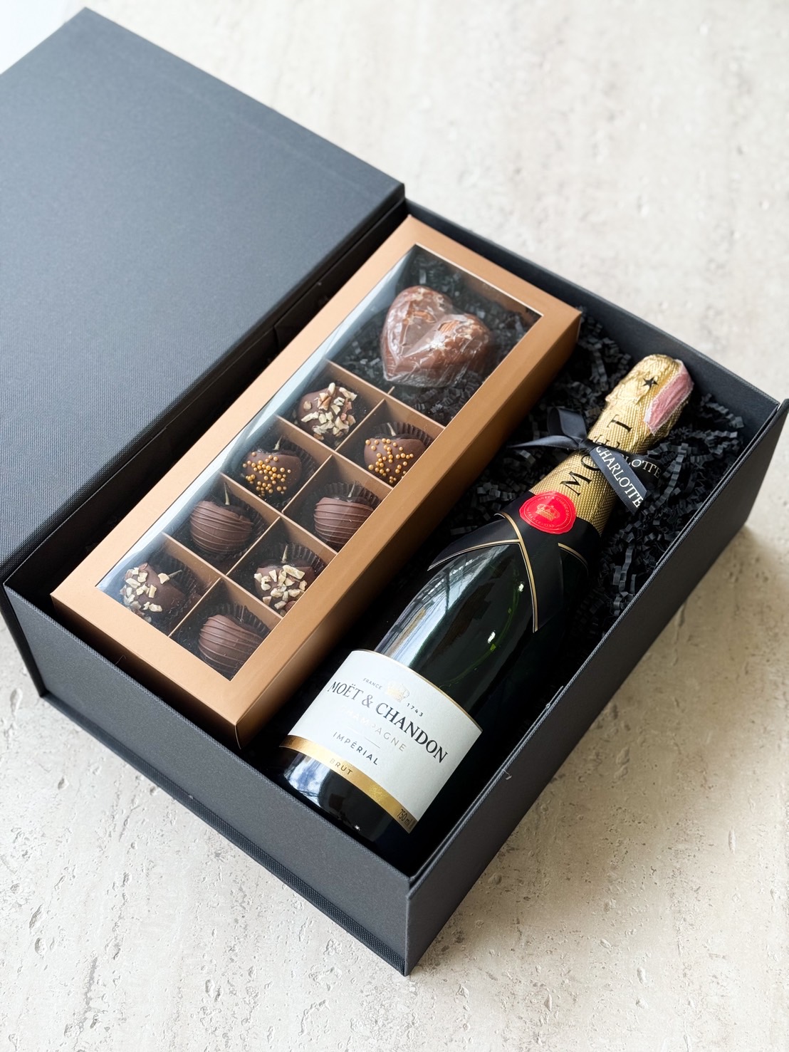 Luxury gift box with Moët & Chandon champagne and assorted chocolate truffles in gold box
