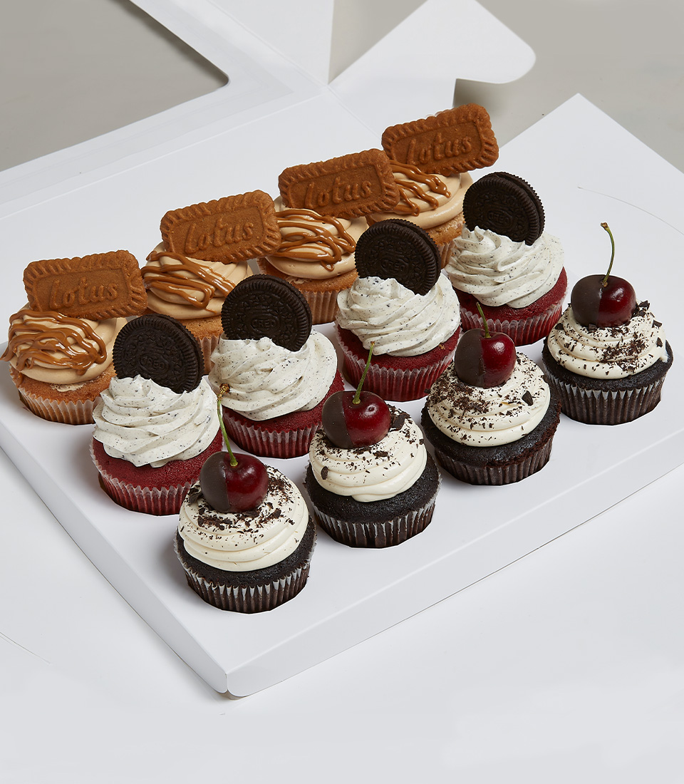 Mix And Match Cupcakes Signature Lotus Biscoff Biscuit Cupcakes, Really Red Velvet Oreo Cupcakes, Dipped Dark Cherry Chocolate Cupcakes in the white box Tied with a white ribbon printscreent with the Charlotte brand. delivered express within 2 hours in Bangkok. Mix And Match Cupcakes