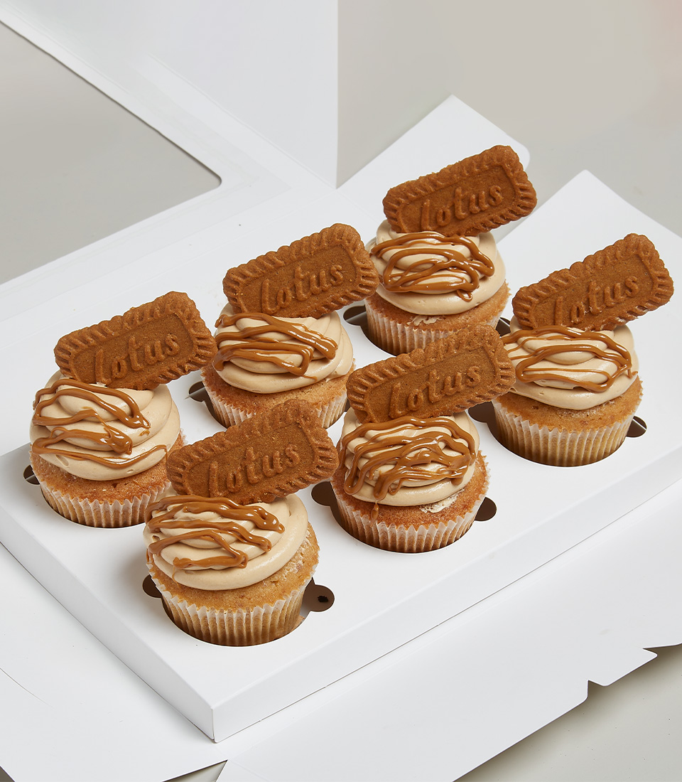 Cupcakes with a bright brown cake texture, light brown frosting on top and Lotus Biscoff topping and Biscoff spread. Signature Lotus Biscoff Biscuit Cupcakes. Express Delivery 2 hr.