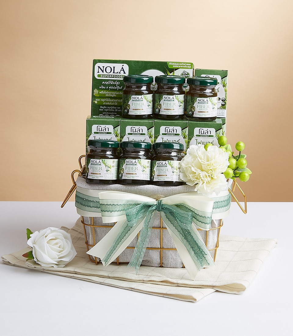 A luxurious gift basket, elegantly adorned with a pristine white ribbon featuring the Basketeer logo, showcases nine exquisite jars of Nola bird's nest soup. The jars are impeccably arranged in two sophisticated tiers—six on the bottom and three on the top. Nestled amidst delicate white flowers and presented on an opulent beige cloth, this gift ensemble epitomizes refined indulgence and sumptuous elegance.