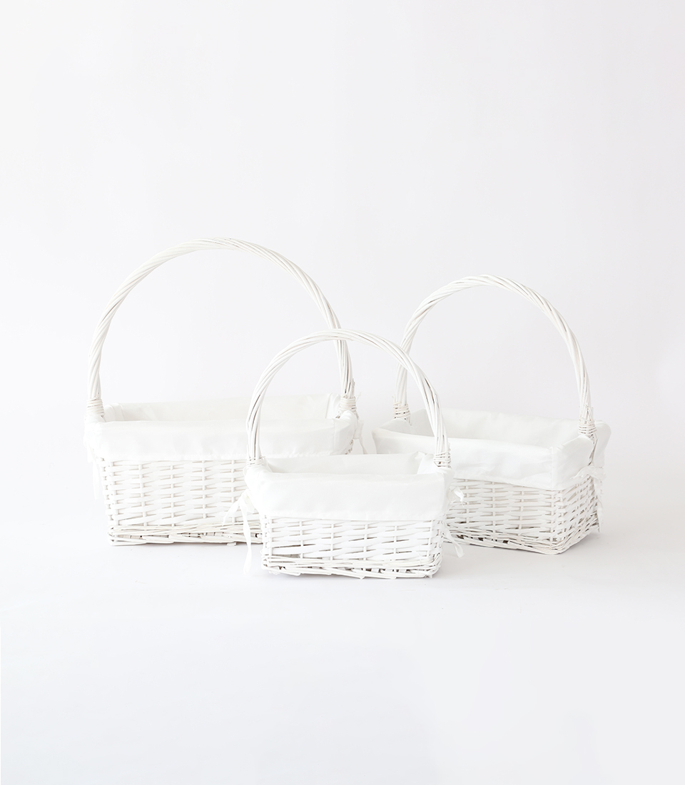 Discover our elegant white wicker baskets with handles and cloth lining inside. These empty baskets combine functionality and sophistication, providing stylish storage solutions for your home.