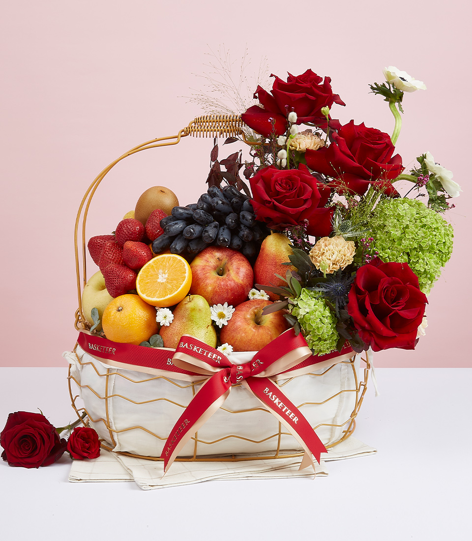 Fresh Fruit With Red Roses And Green Hydrangeas Flowers In The Golden Steel Frame Basket.