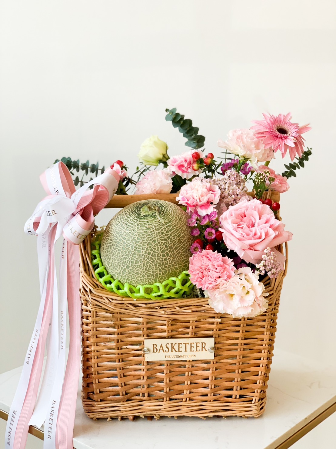 A wicker gift basket labeled 