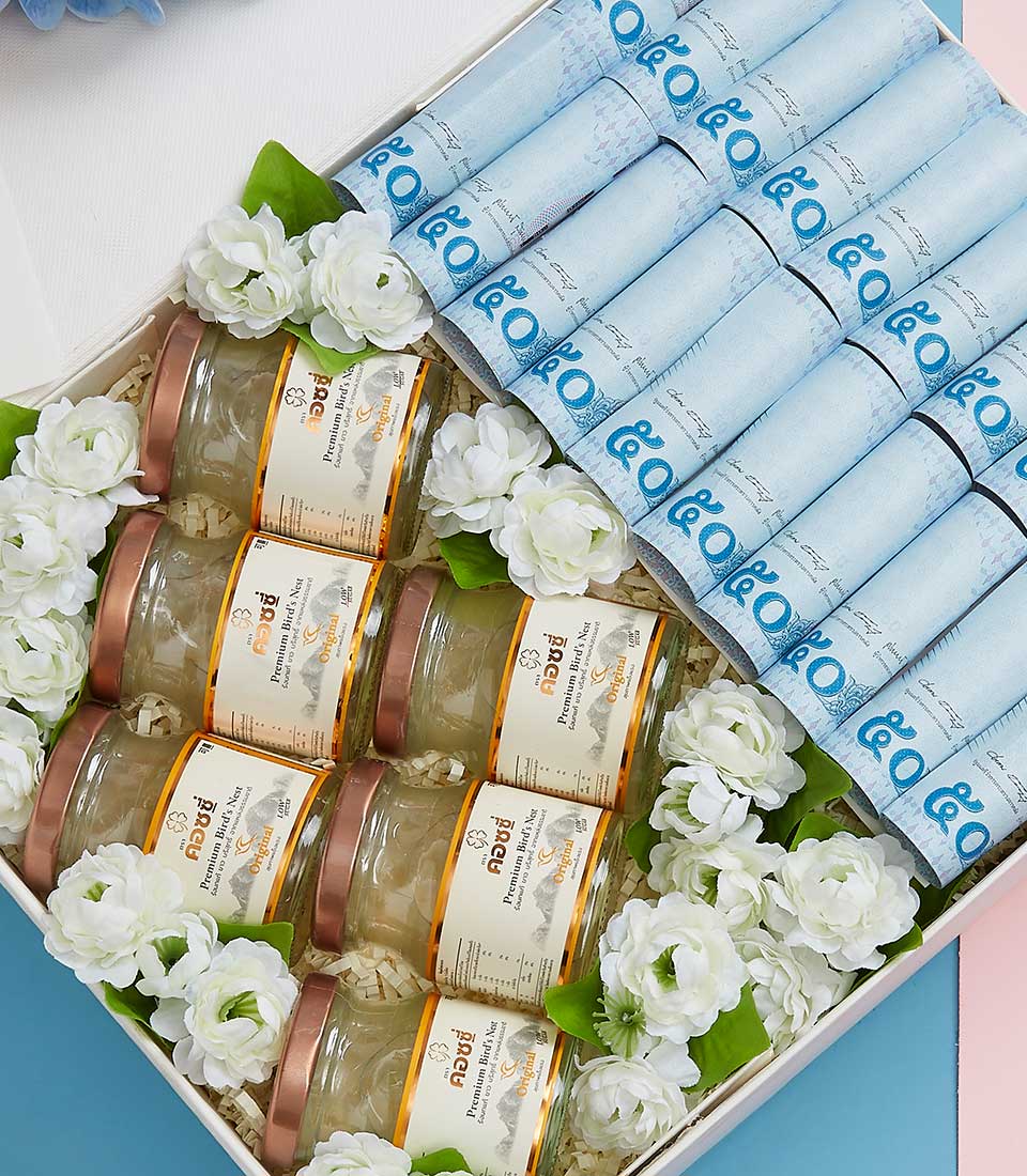 An elegantly curated Basketeer gift box showcases a luxurious collection of golden-lidded 