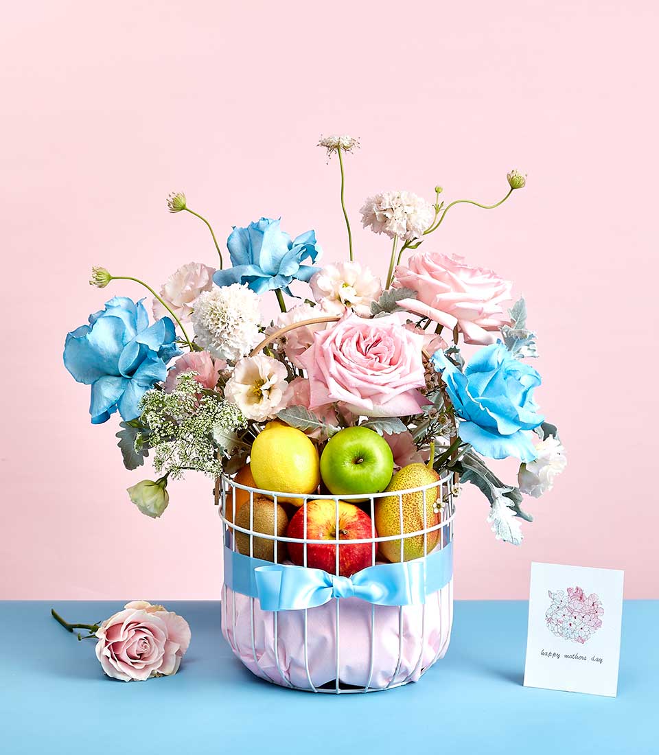 Pink and Sky Blue Roses With Mixed Fresh Fruits Gift In The White Steel Frame Basket