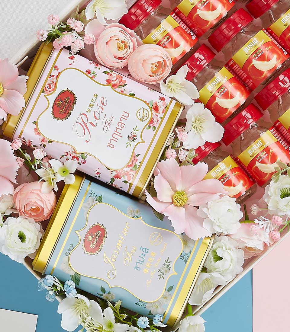 A lavish Basketeer gift box exquisitely presented with two elegant tins labeled 