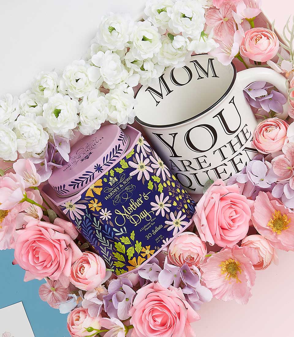 A stunning floral arrangement showcases a beautifully designed tin adorned with 