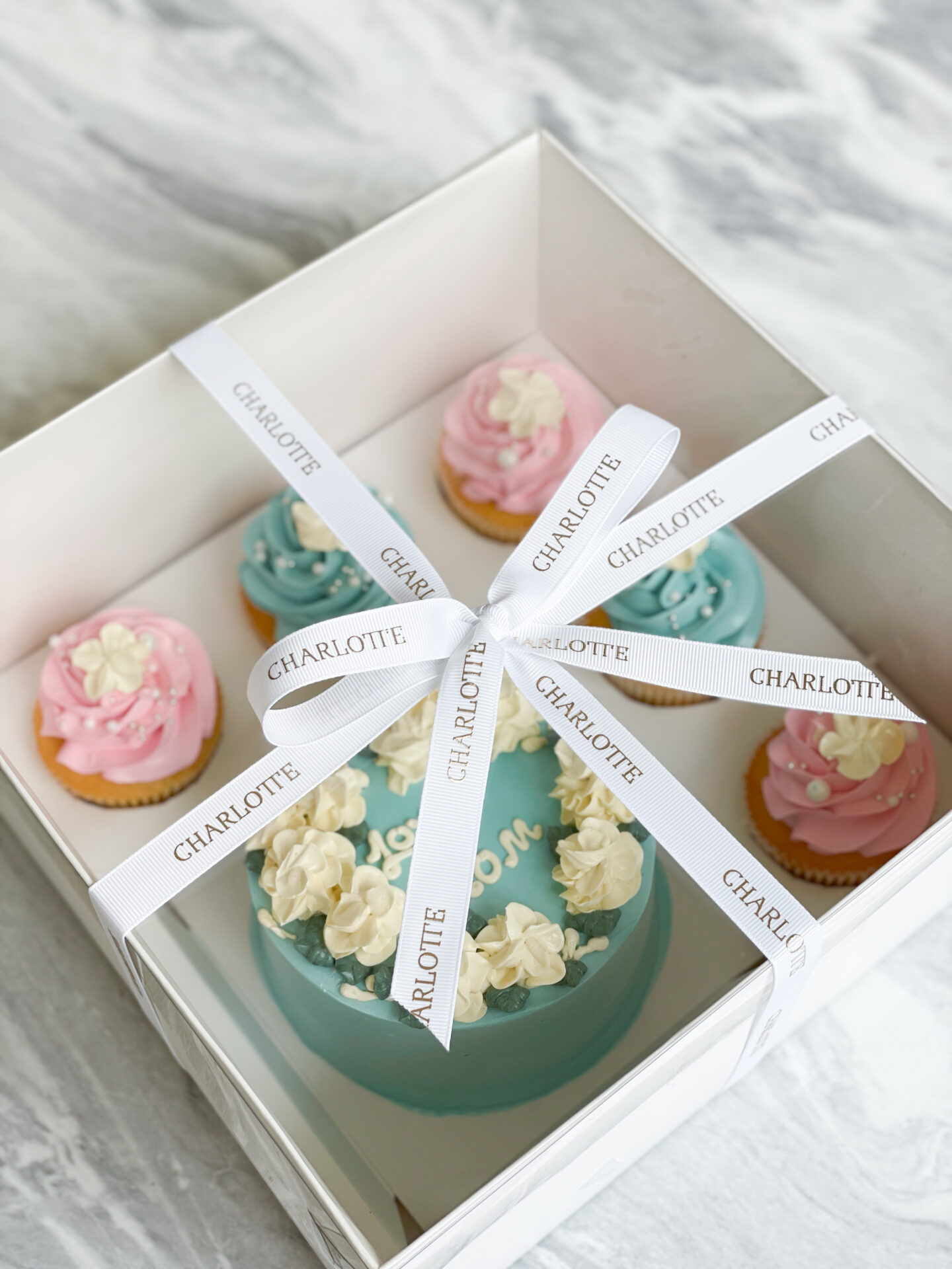 A pristine white box elegantly labeled 